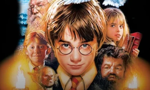 Three young wizard students walking together under a cloudy sky in a scene from Harry Potter.