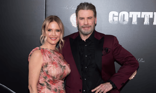 A classic photo of John Travolta and his late wife, Kelly Preston, at a public event.