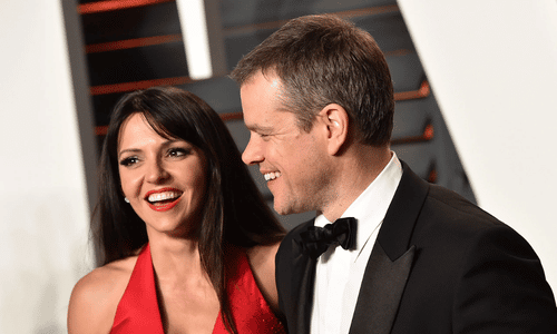 Matt Damon and his wife Luciana Barroso smiling together at a film premiere, representing a successful celebrity-fan marriage.