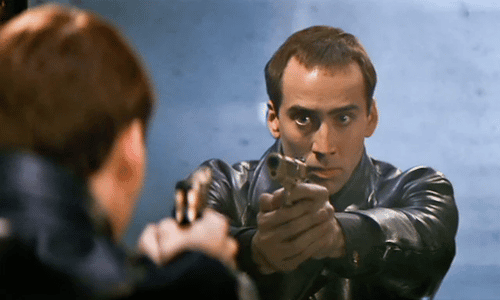 Nicolas Cage at a press event, showcasing his signature intense and charismatic expression.