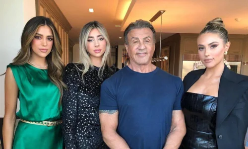 This image shows Sylvester Stallone with his three daughters, Sophia, Sistine, and Scarlet Stallone