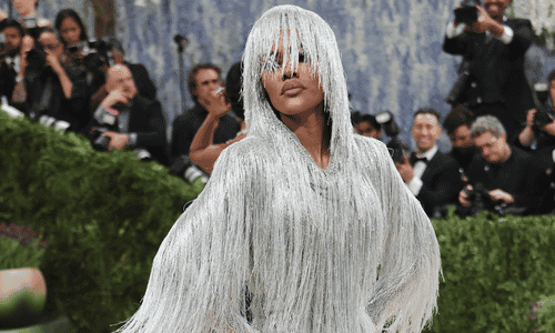 Teyana Taylor in a visually striking look with bold textures and cinematic tailoring on the Met steps.