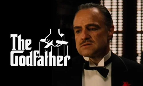 Marlon Brando as Don Vito Corleone sitting in his dark office in a scene from The Godfather.