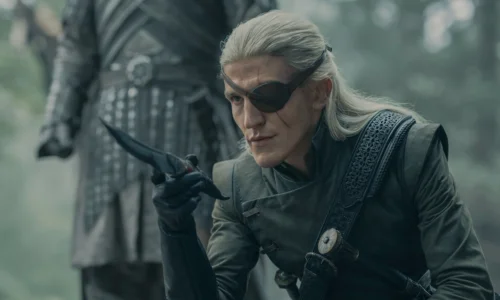 Ewan Mitchell as Prince Aemond Targaryen wearing a black leather eye patch in House of the Dragon.
