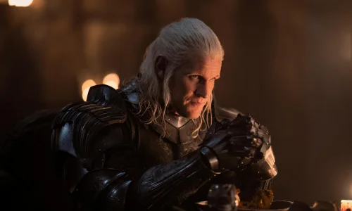 Matt Smith as Prince Daemon Targaryen in a heavily shadowed, low-light dramatic scene.