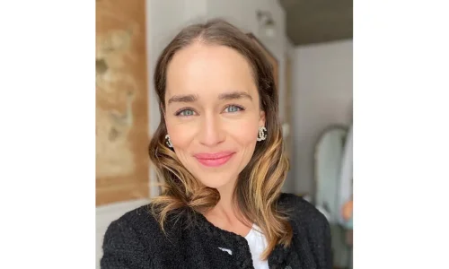 Emilia Clarke smiling in a casual portrait during her early career