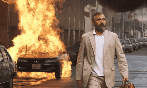 A bearded George Clooney portraying CIA operative Bob Barnes in the political thriller Syriana.