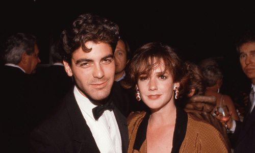 George Clooney posing alongside his former wife, actress Talia Balsam, at an early red carpet appearance.