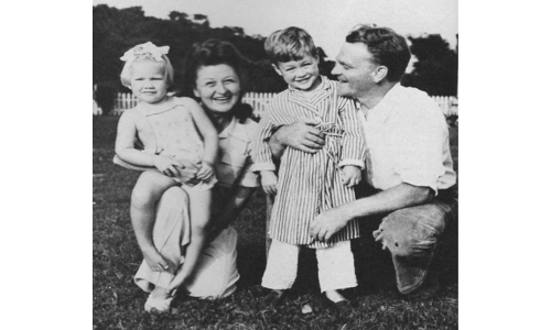 James Cagney posing with his wife and children in a vintage family photograph