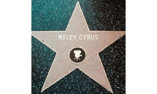 A close-up view of miley cyrus star on the Hollywood Walk of Fame.