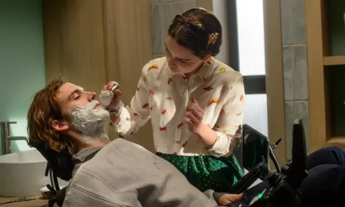 Lou Clark applies shaving cream to Will Traynor in a scene from "Me Before You."