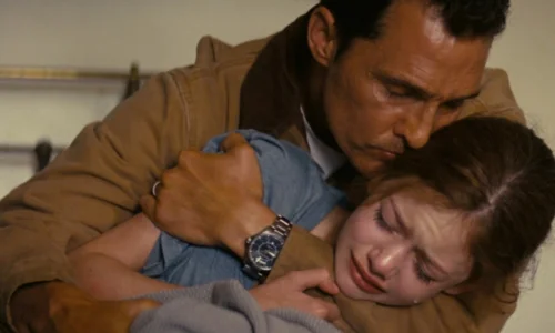 Matthew McConaughey tearfully embraces his young daughter Murph before his space mission in Interstellar.