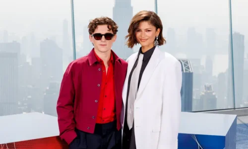 Zendaya and Tom Holland posing together at the Spider-Man Brand New Day photo call