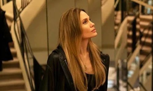 Angelina Jolie posing at a public event as an actress and filmmaker