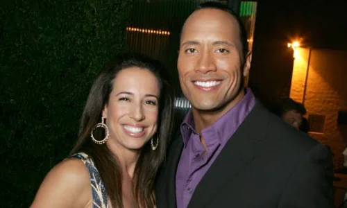 Dwayne Johnson and Dany Garcia posing together at a public event