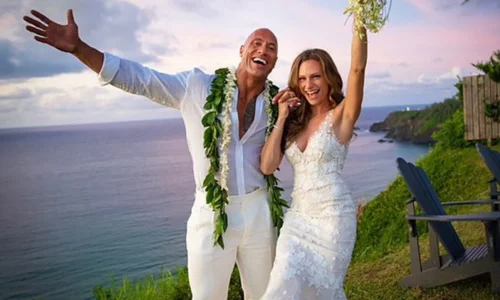 Dwayne Johnson and Lauren Hashian wearing white outfits at their Hawaii wedding