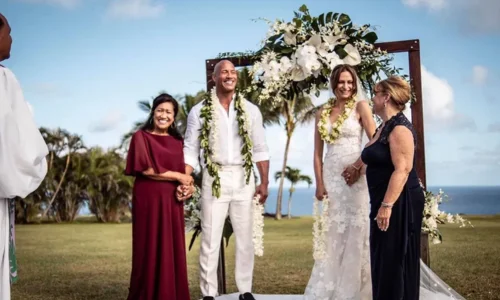 Dwayne Johnson and Lauren Hashian smiling together in wedding photos