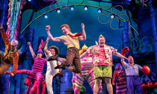 Ethan Slater and cast members performing on stage in SpongeBob SquarePants The Broadway Musical