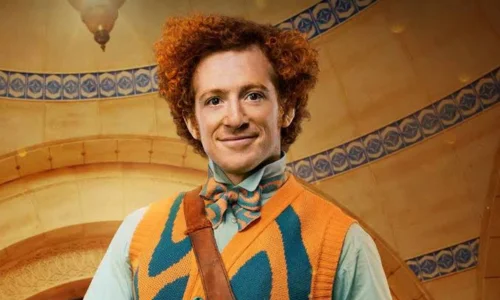 Ethan Slater dressed as SpongeBob in a colorful Broadway stage costume