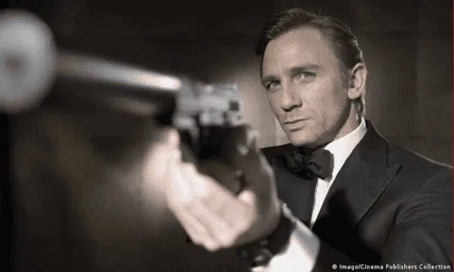 Daniel Craig as James Bond holding a gun in a spy movie scene