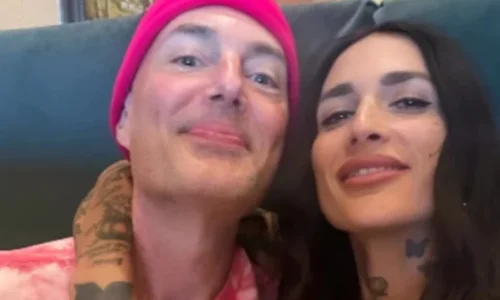James Haven in a pink beanie and tie-dye shirt smiles next to ex-wife Romi Imbelli in a live-stream screenshot.