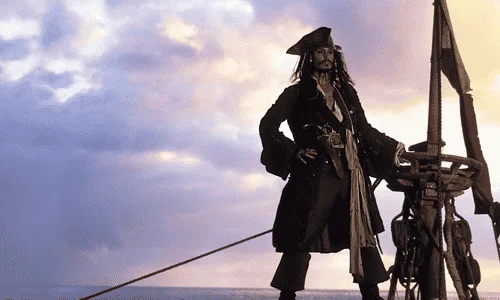 Johnny Depp wearing a pirate hat and costume in a Disney movie scene