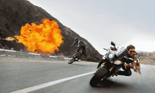 Tom Cruise as Ethan Hunt in a Mission Impossible action scene