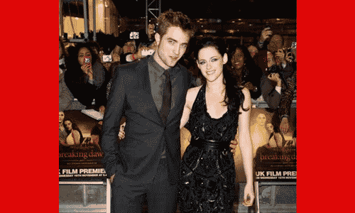 Robert Pattinson and Kristen Stewart standing together at a public event