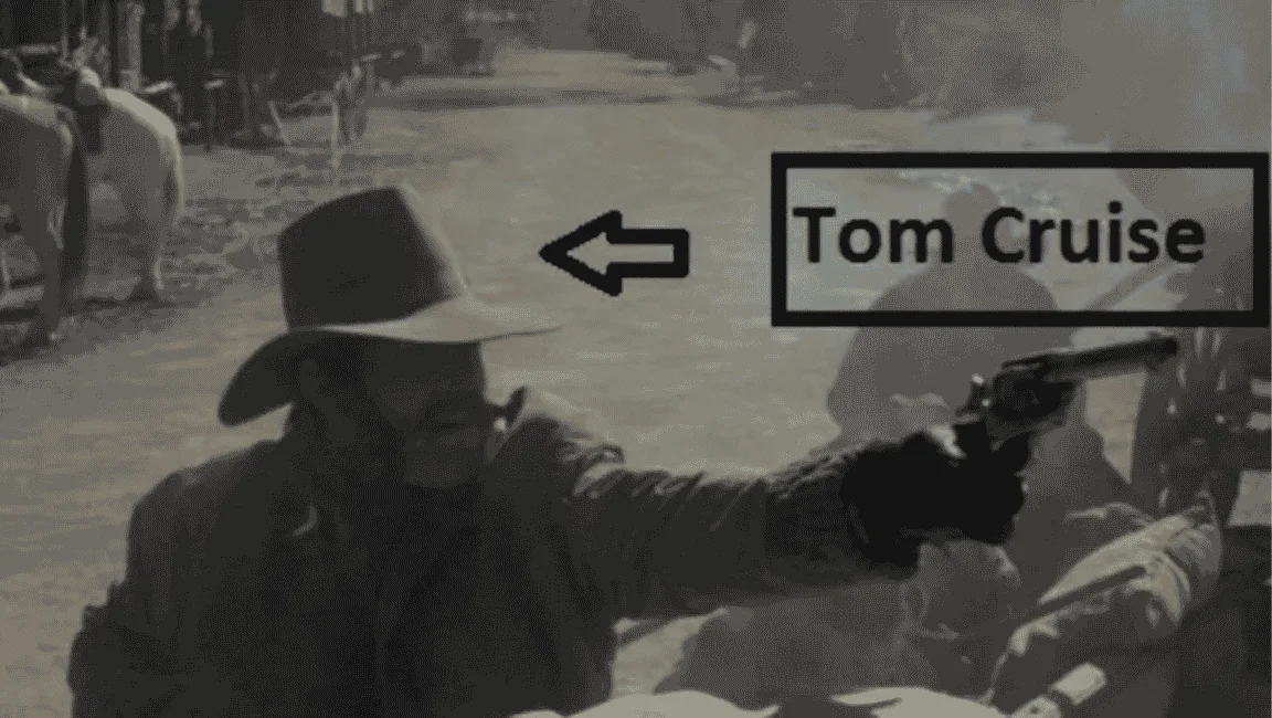 Tom Cruise wearing a cowboy hat and mustache during his uncredited Young Guns cameo