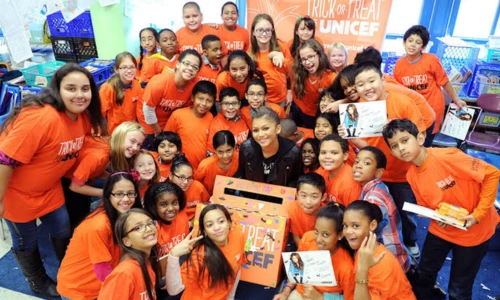 Zendaya posing at a public event while supporting relief and youth-focused causes