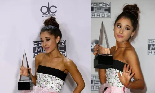 Ariana Grande holds an award in a strapless floral dress and braided high top knot at the AMAs.