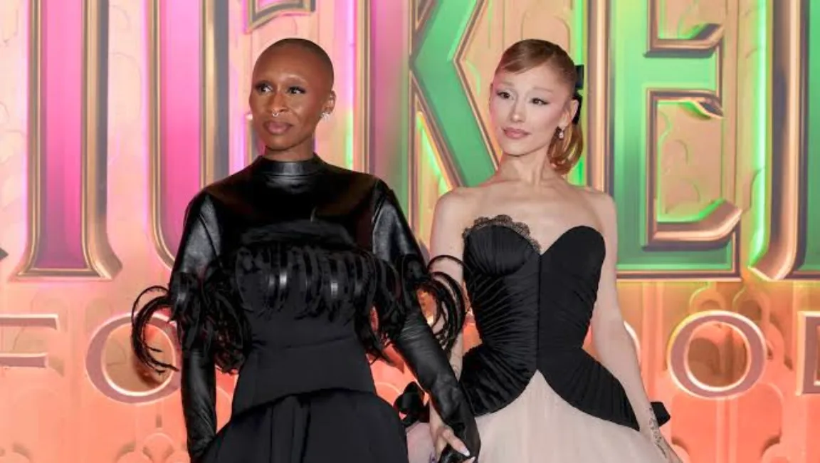 Ariana Grande and Cynthia Erivo posing together at a Wicked promotional event