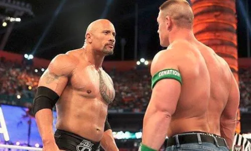 John Cena and The Rock facing off during their WWE WrestleMania rivalry