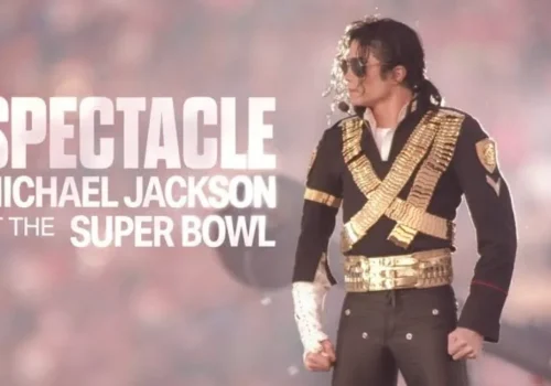 Michael Jackson performs at the Super Bowl in his gold-strapped jacket with "Michael Jackson Super Bowl" text.