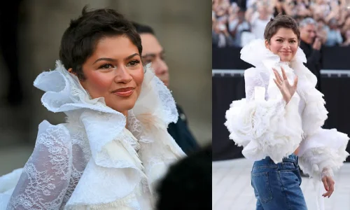 Zendaya wearing a dramatic white lace ruffled top with blue jeans at The Odyssey premiere.