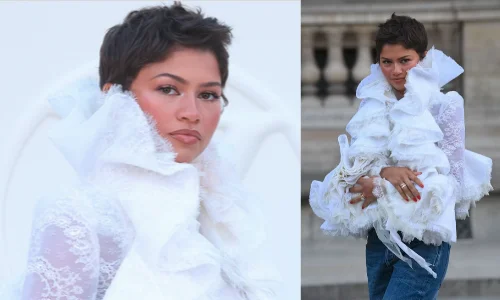Zendaya wearing a dramatic white lace ruffled top with blue jeans at The Odyssey premiere.